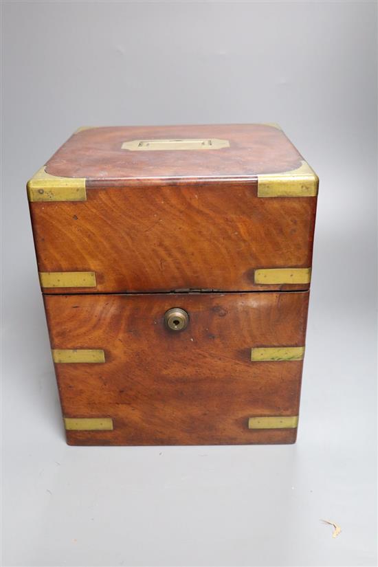 A mid 19th century mahogany and brass bound decanter case, containing three decanters and two associated glasses and a silver plated wi